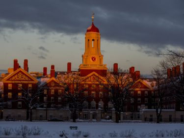 A harvard building during sunset