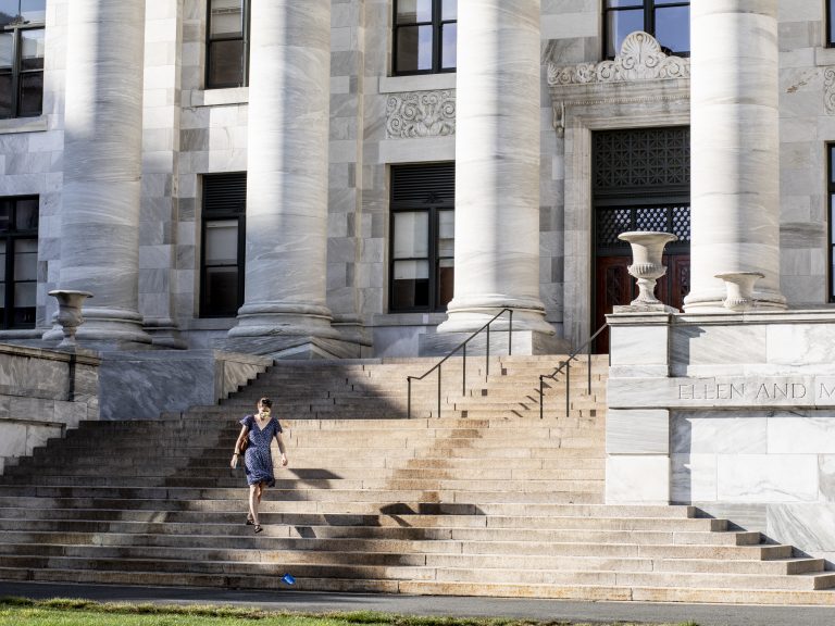 A person walking by a building