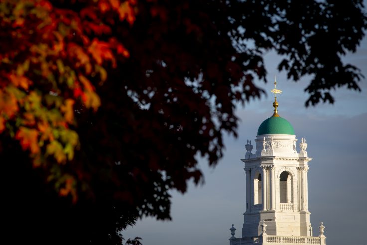 The top of a Harvard building with a blue roof