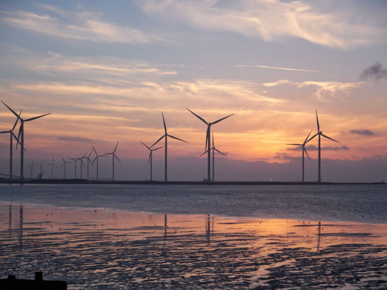 windmills against a sunset