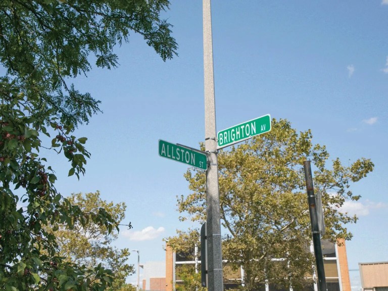 A street sign that says Brighton and Allston