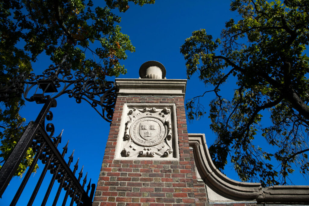 Harvard gate against a blue sky.