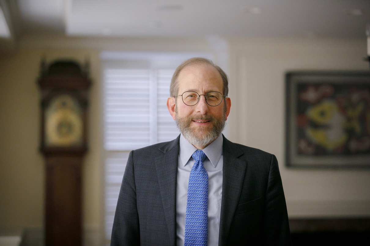 Alan Garber wearing a blue suit and tie.