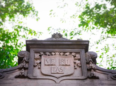Harvard yard gate veritas shield