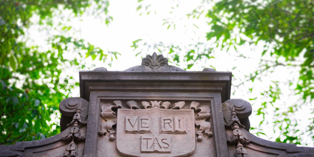Harvard yard gate veritas shield