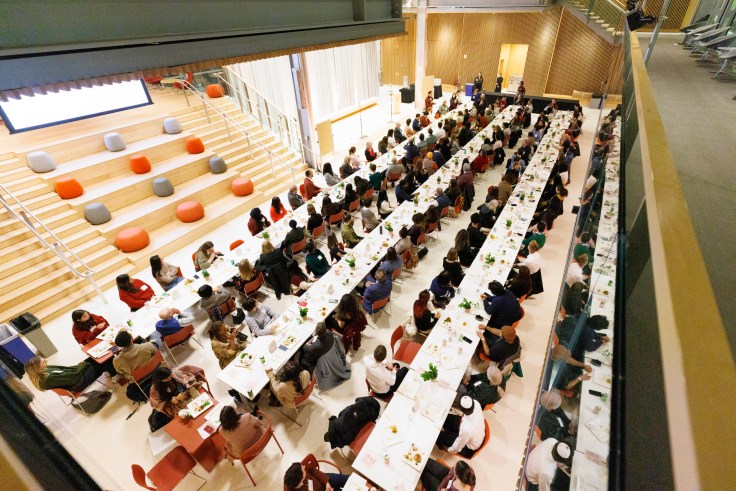 Students sitting at tables in the Smith Campus Center