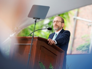 Alan Garber speaking at a podium