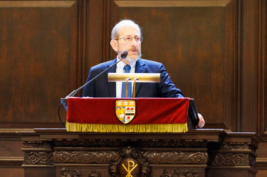 Alan Garber talking at a podium