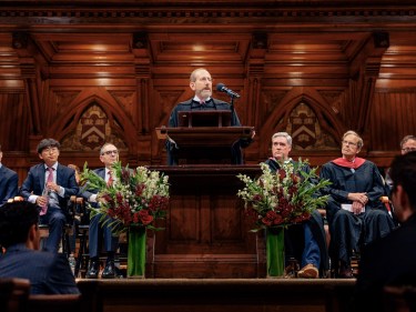 Harvard President Alan Garber at a podium