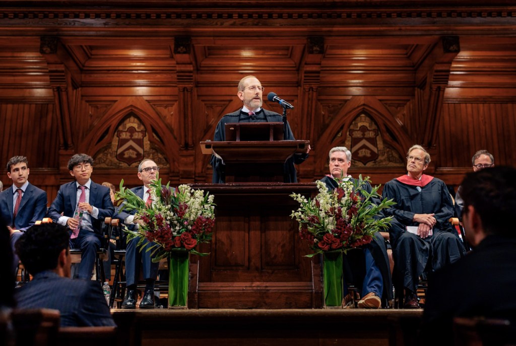 Harvard President Alan Garber at a podium