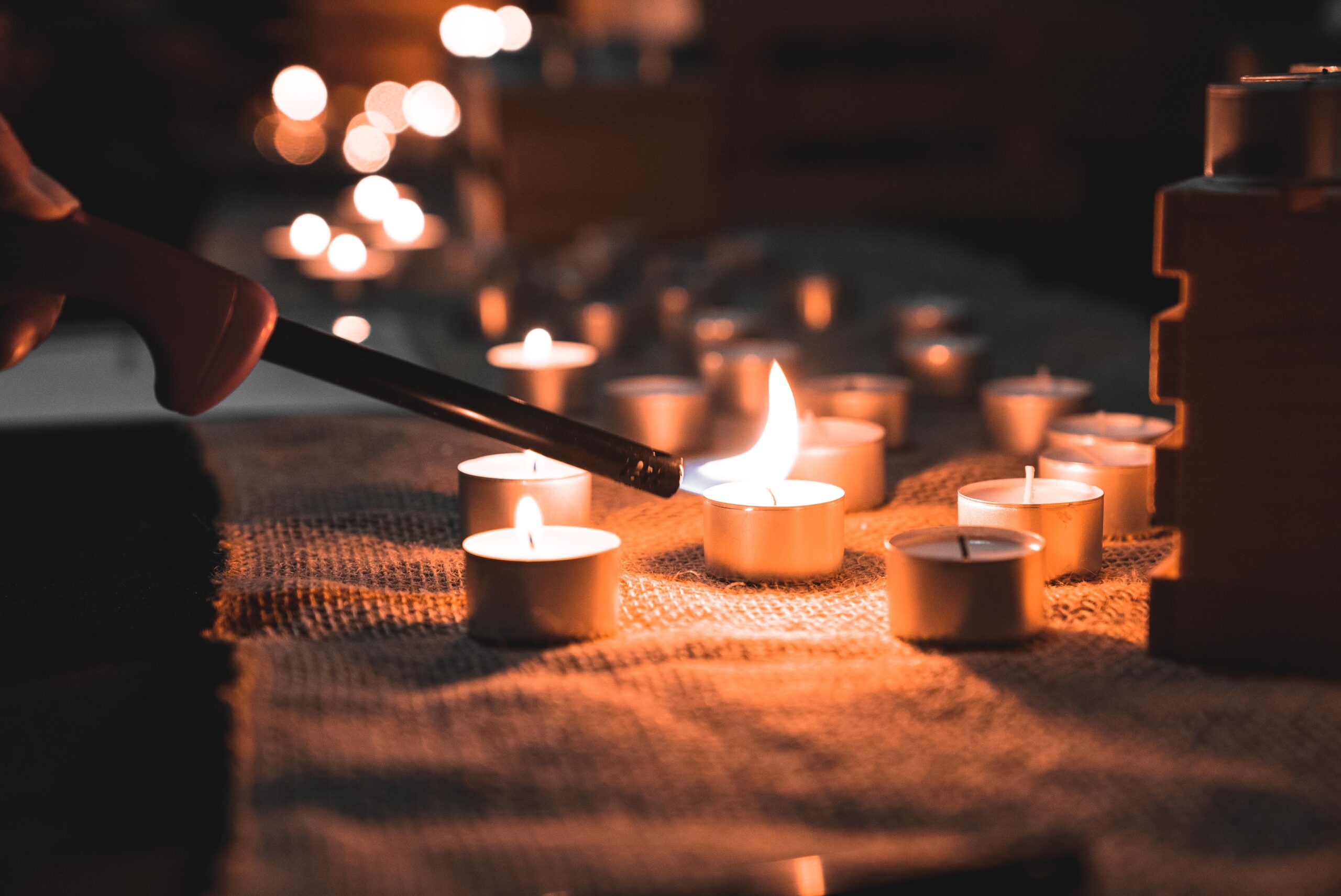 A person lighting candles