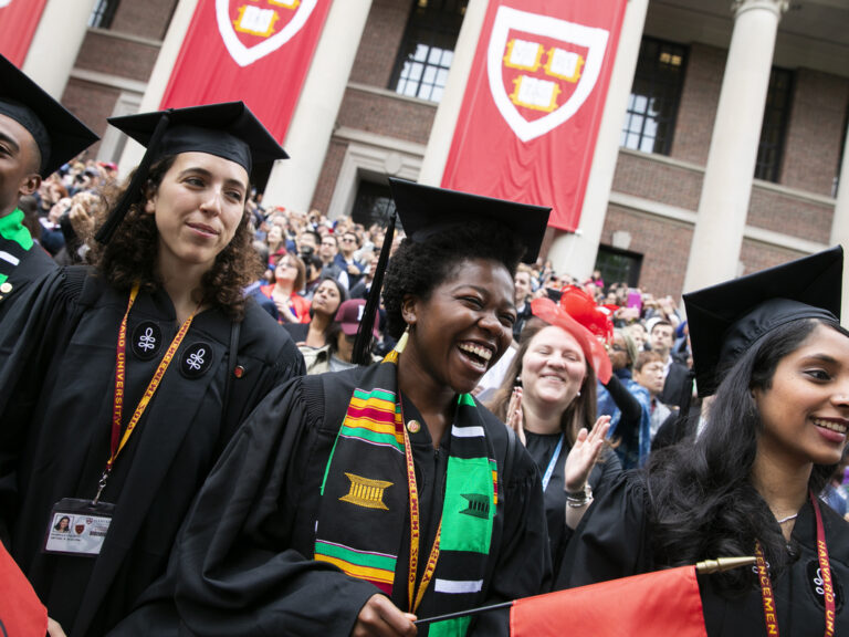 Students in graduation gowns at Commencement