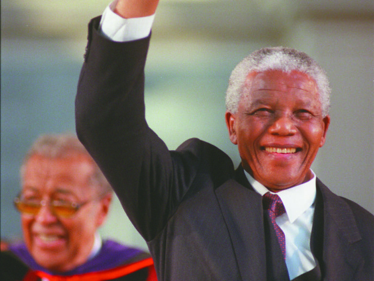 Nelson Mandela waving to the crowd at commencement