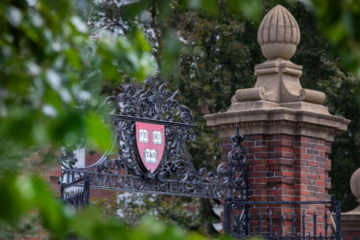 A Harvard gate with the "Veritas" shield