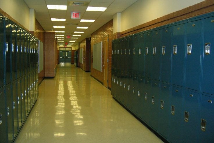 An empty school hallway with lockers