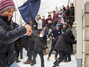 Student having a snowball fight