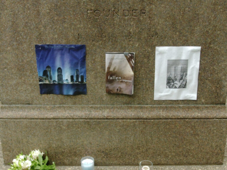 A small memorial to 9/11 in front of the John Harvard statue