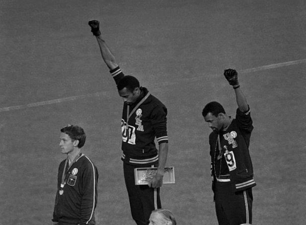 Two men showing the Black power fist on the olympic podiums