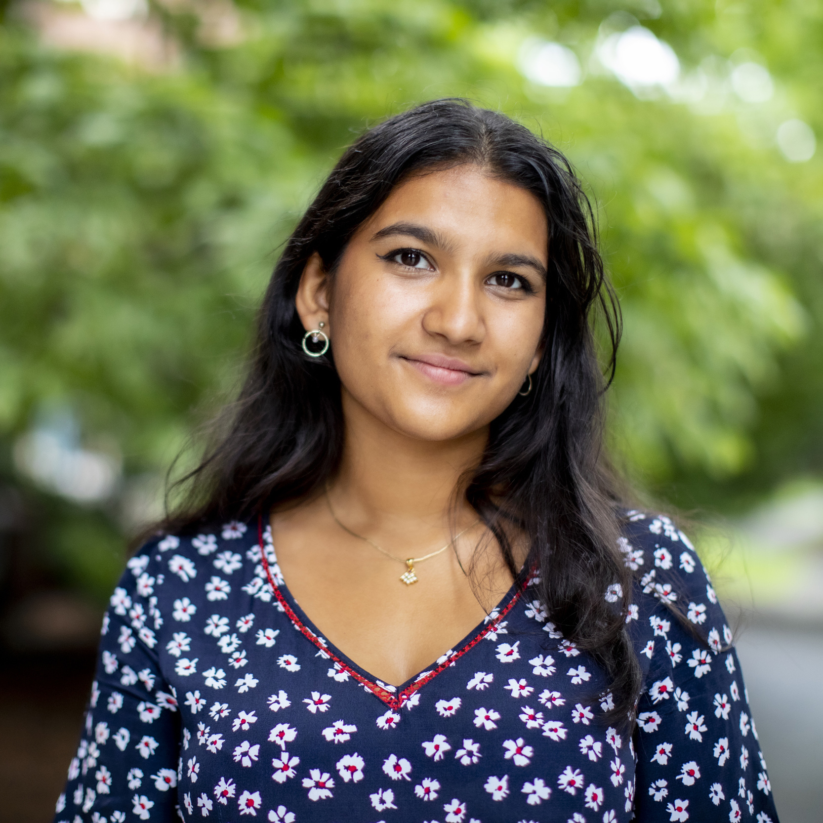 A student stands outside