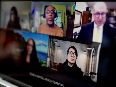 A Zoom screen featuring students and faculty members.