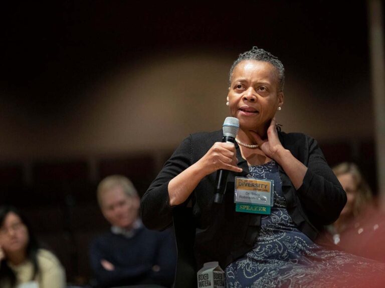 Tracy Robinson-Wood, a professor in Northeastern’s Department of Counseling and Applied Educational Psychology, speaks to a crowd