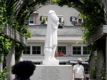 A beheaded statue of Christopher Columbus