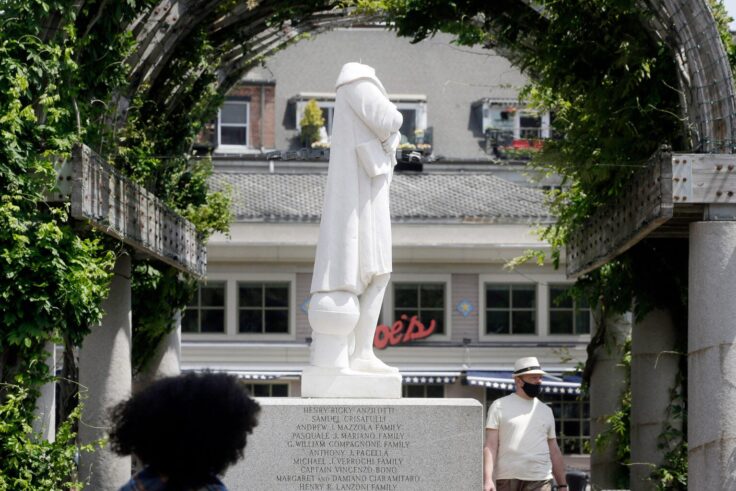 A beheaded statue of Christopher Columbus