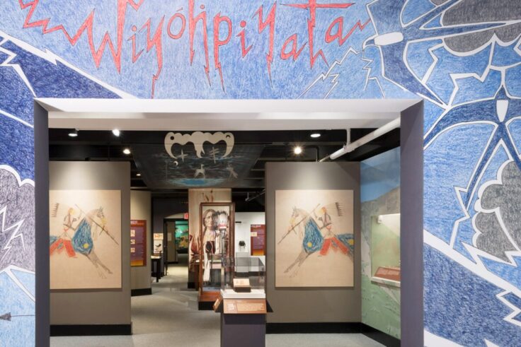 A museum entrance with Native American art