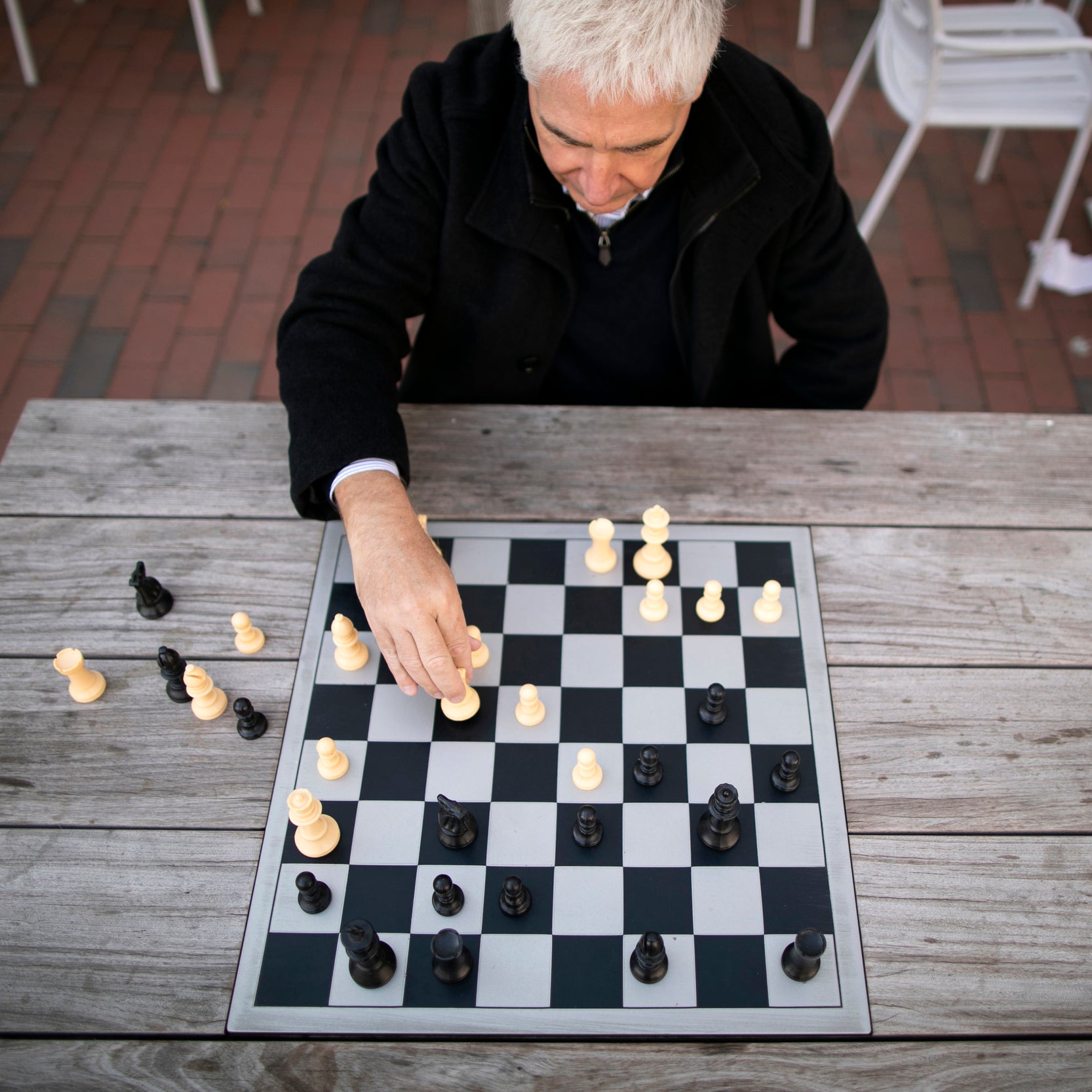 A man plays chess