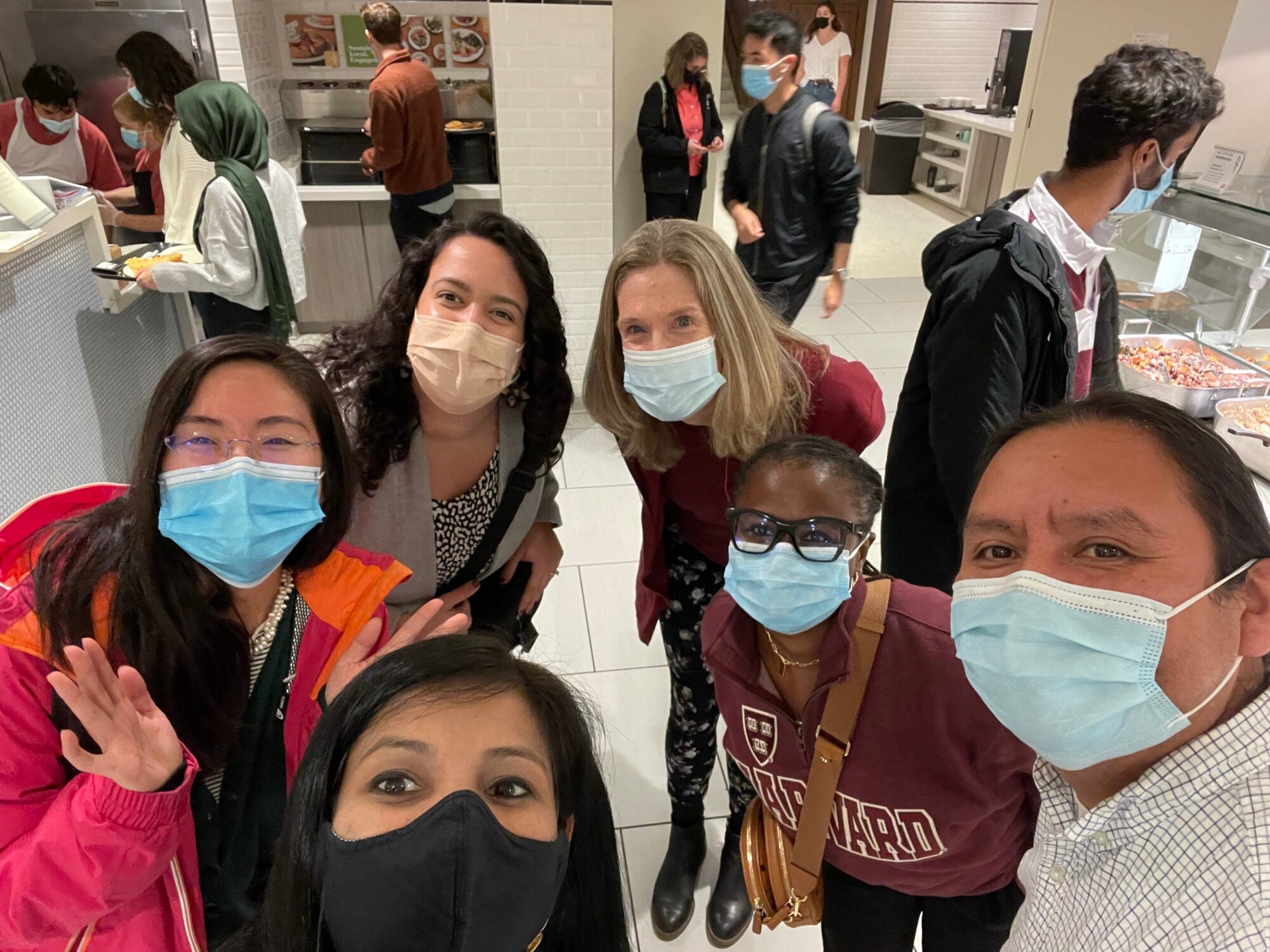 Students with masks on smiling