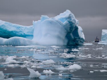 A glacier rests in the water in the Antarctic