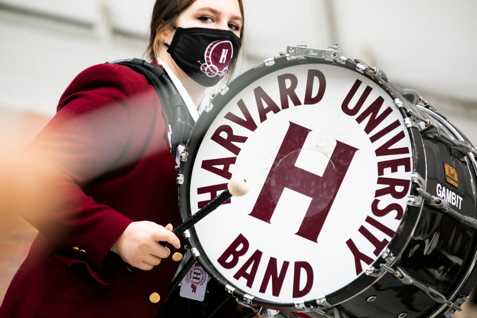 A member of the Harvard band plays the drums