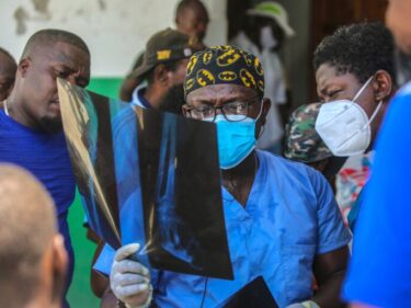 Haitian doctor looks at X-ray.