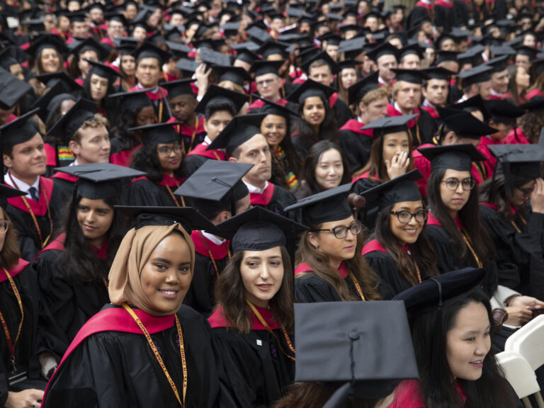 Students in graduation gowns and caps