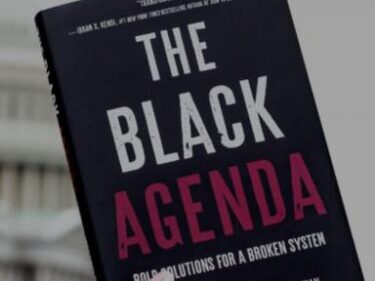 Someone holding a book called "The Black Agenda"