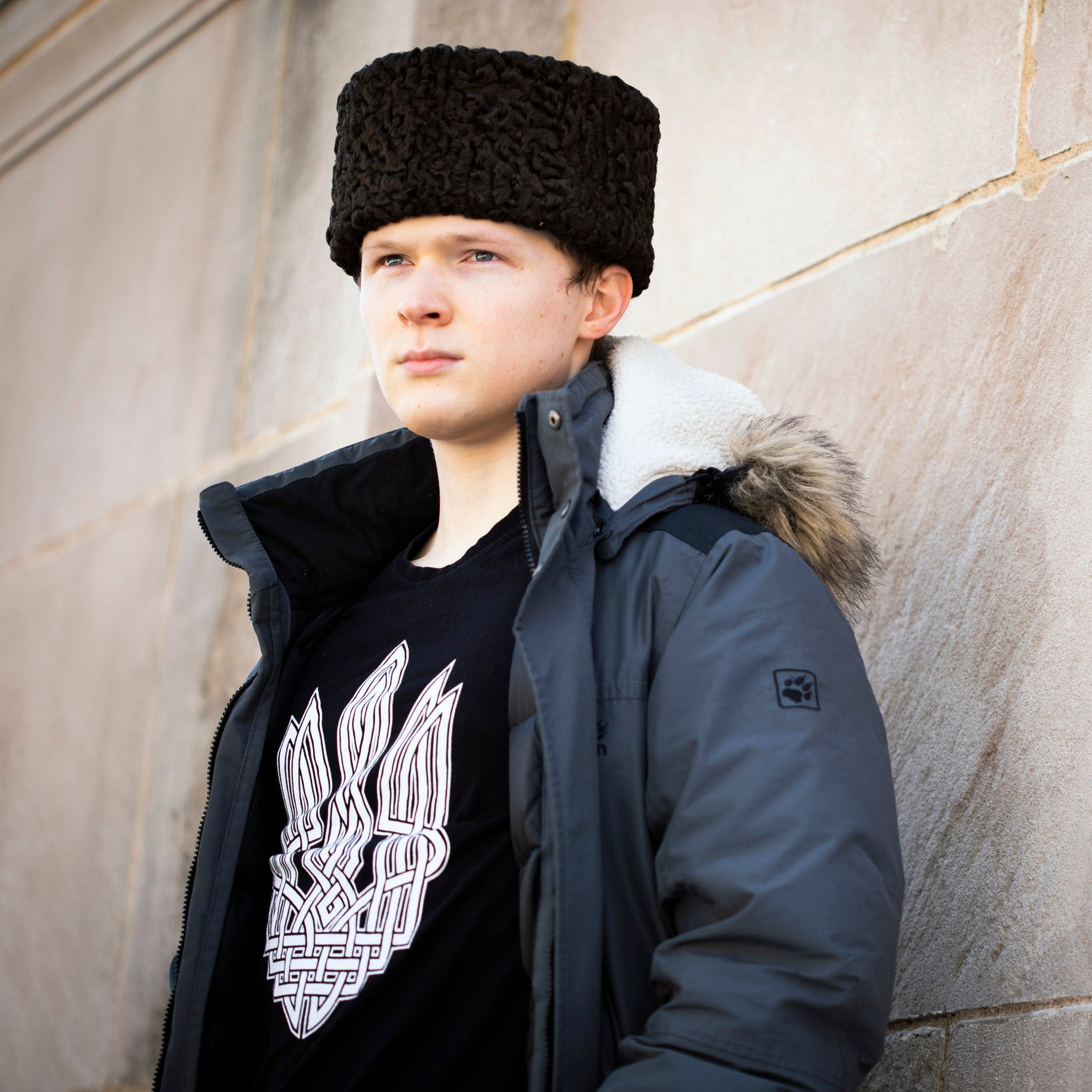 A student wearing a traditional Ukrainian hat
