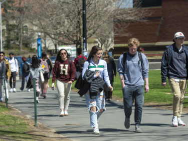 students walk through campus