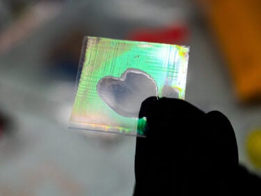 A piece of glass with fluorescent colors painted on it