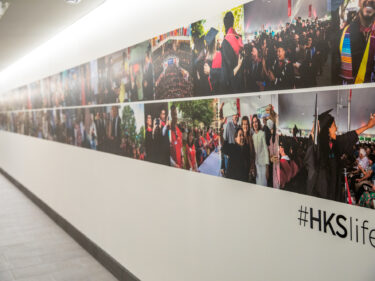 A wall featuring many different photos