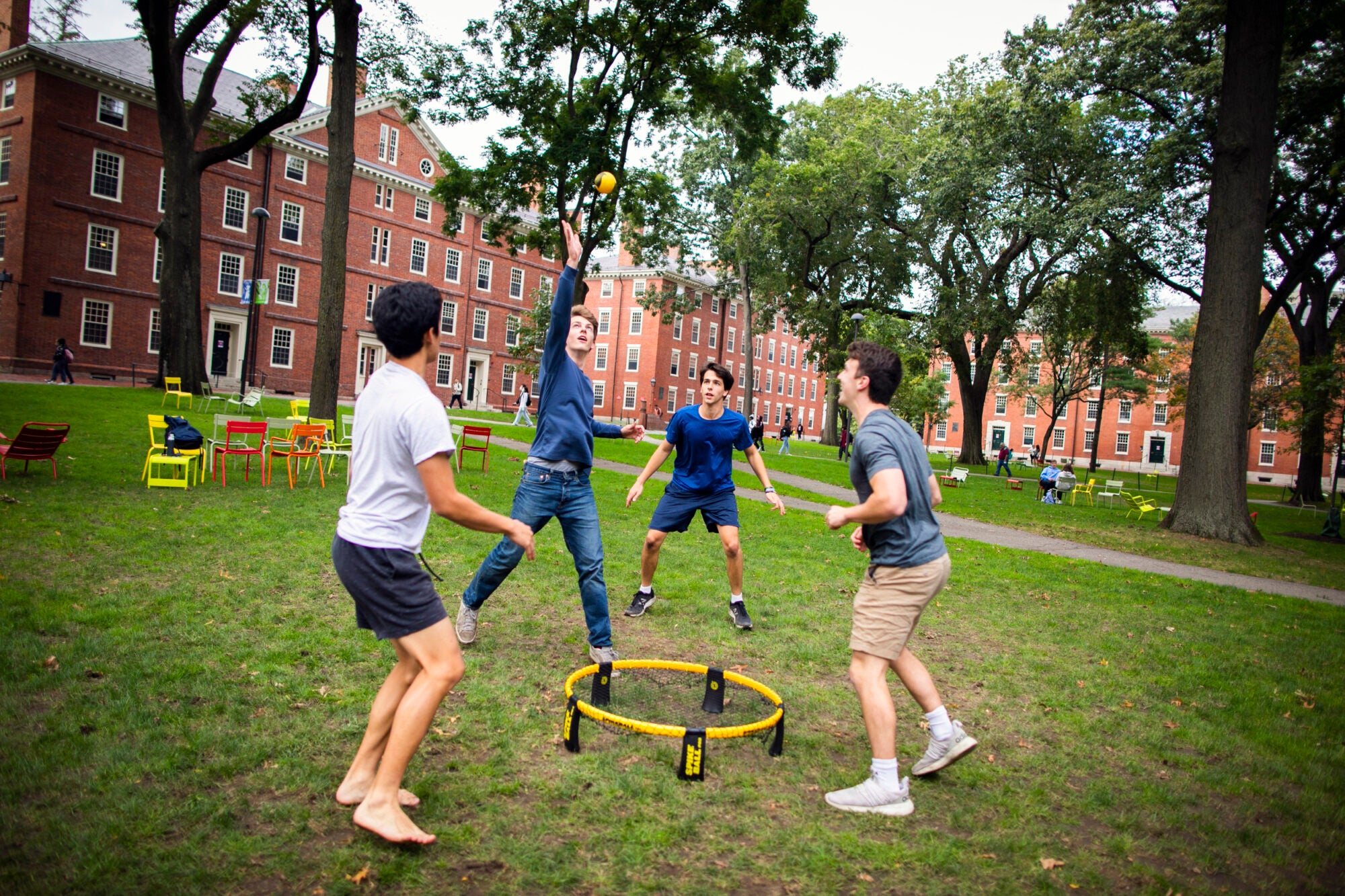 Four students play spike ball