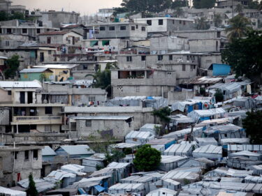 Houses and tents on a hill