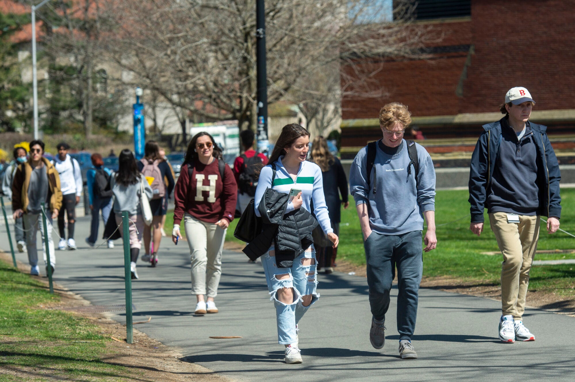 Students walk through campus on an early spring day