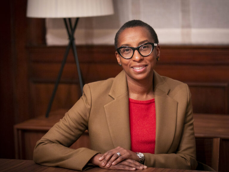Claudine Gay at a desk