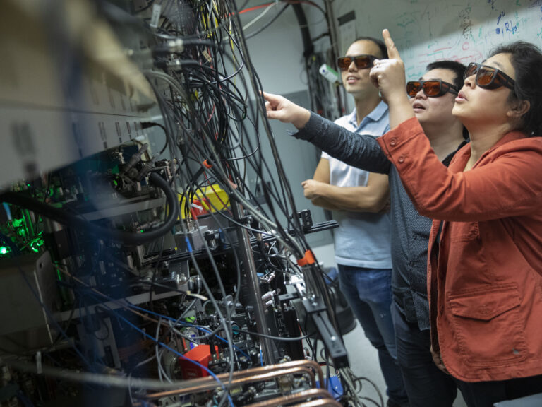 Three people in a lab