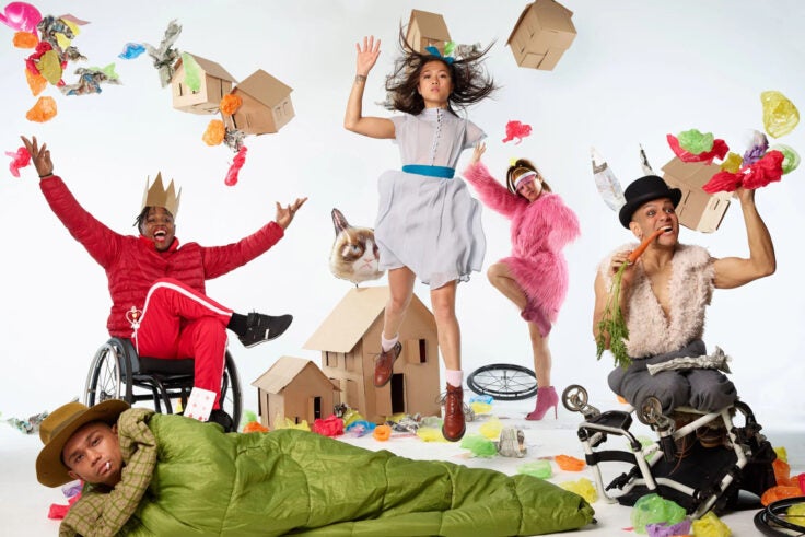 Dancers surrounded by objects