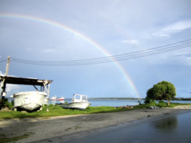 A rainbow shining over a beach