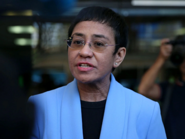 Maria Ressa in a blue jacket