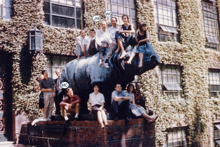 Students sitting on a rhino statue