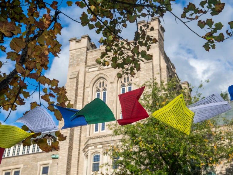 Prayer flags in front of a Divinity School building