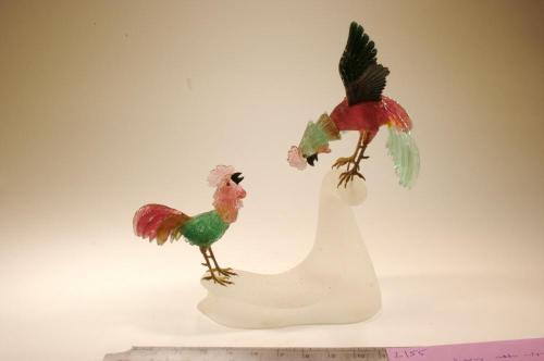 Roosters carved out of colorful stones